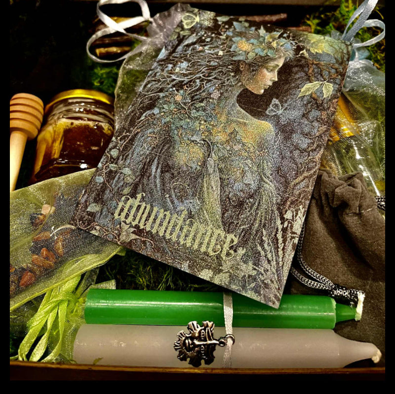 Beltane Sabbat Box experience with organic honey comb, candles, anointing oil, incense & Abundance altar card.
